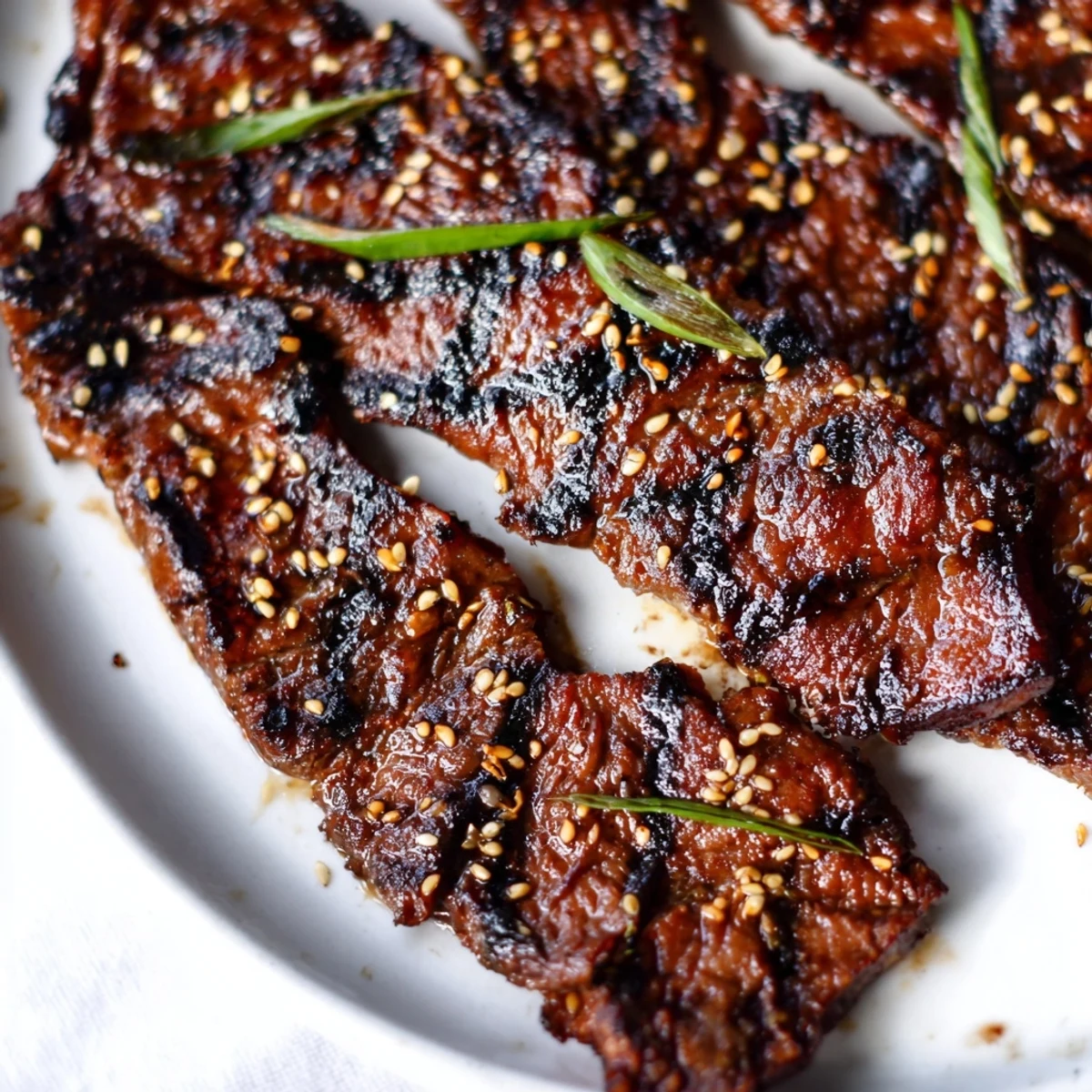 Tender beef short ribs glazed in sweet soy marinade, grilled to smoky perfection with green onion topping