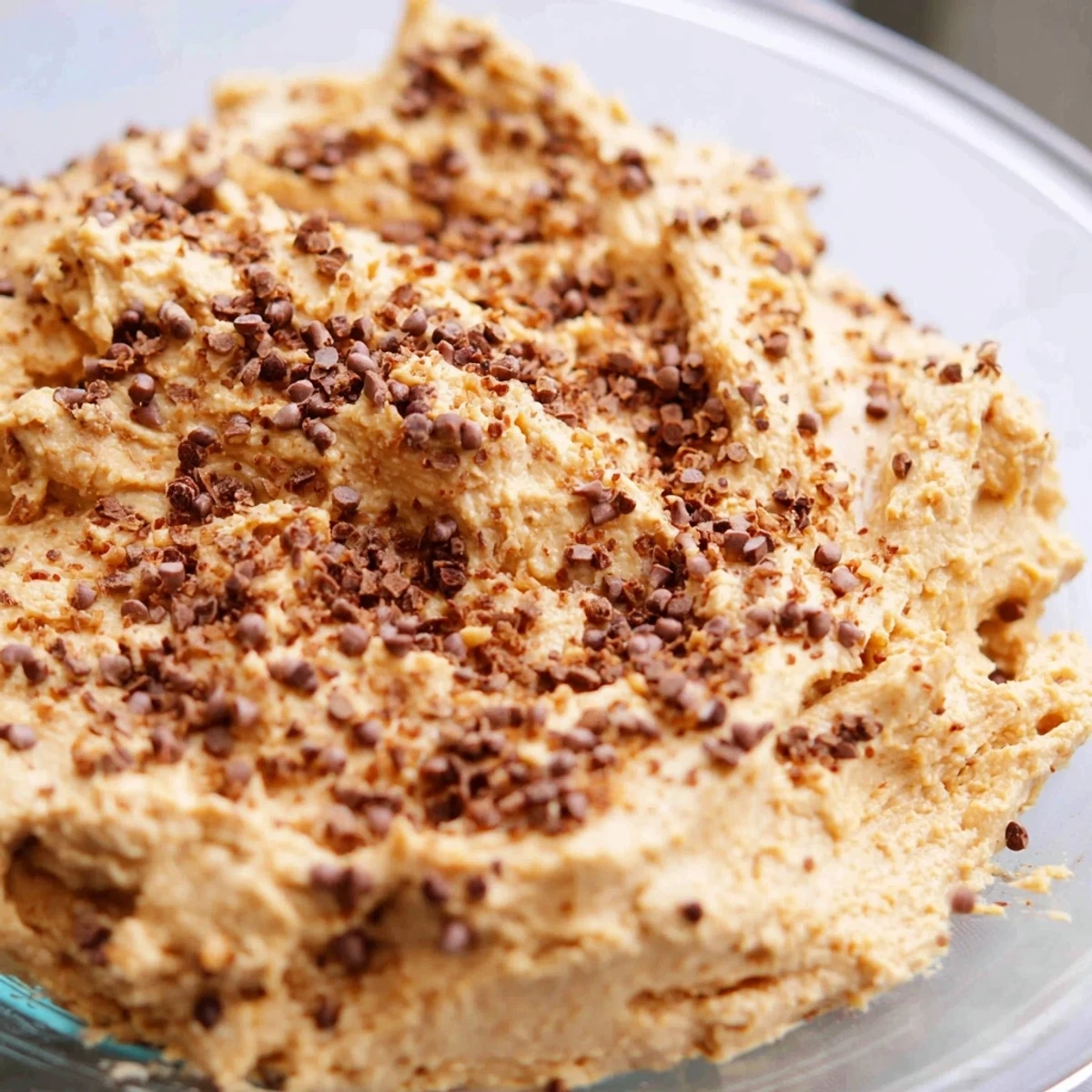 Smooth American peanut butter mousse with whipped Cool Whip served chilled in individual dessert glasses with chocolate and peanut toppings