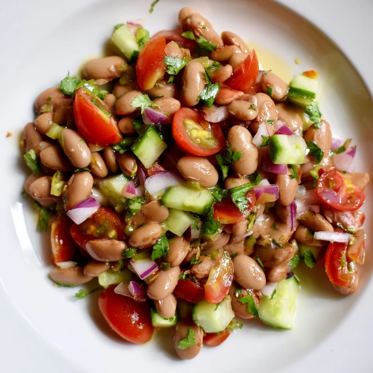 Colorful pinto bean salad tossed with crisp vegetables and bright lime dressing