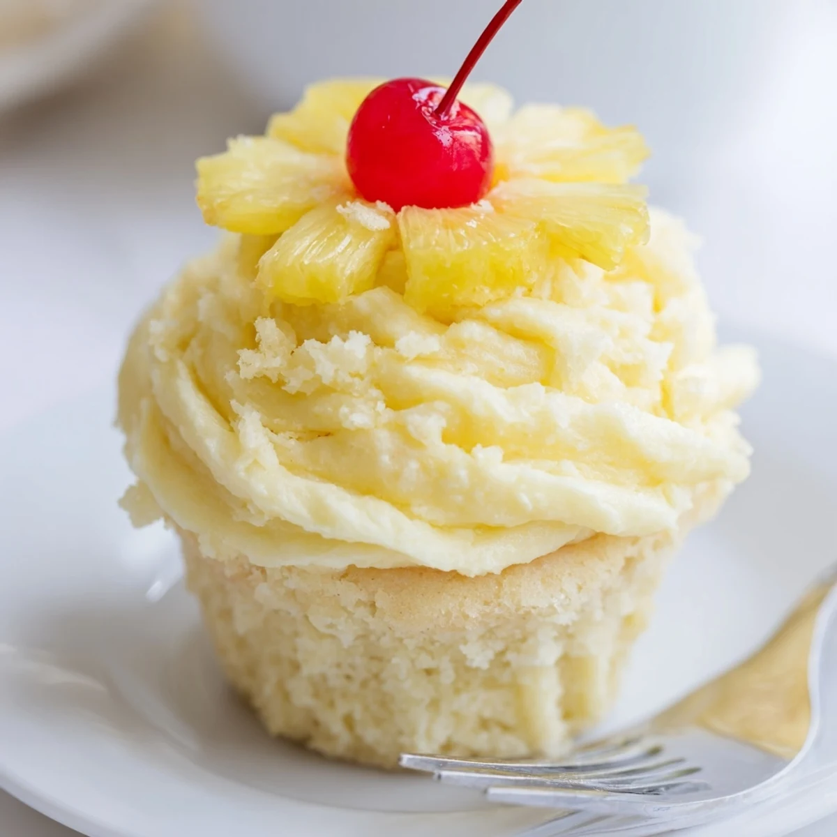Dole Whip Cupcakes Recipe plated for summer parties, garnished with dried pineapple