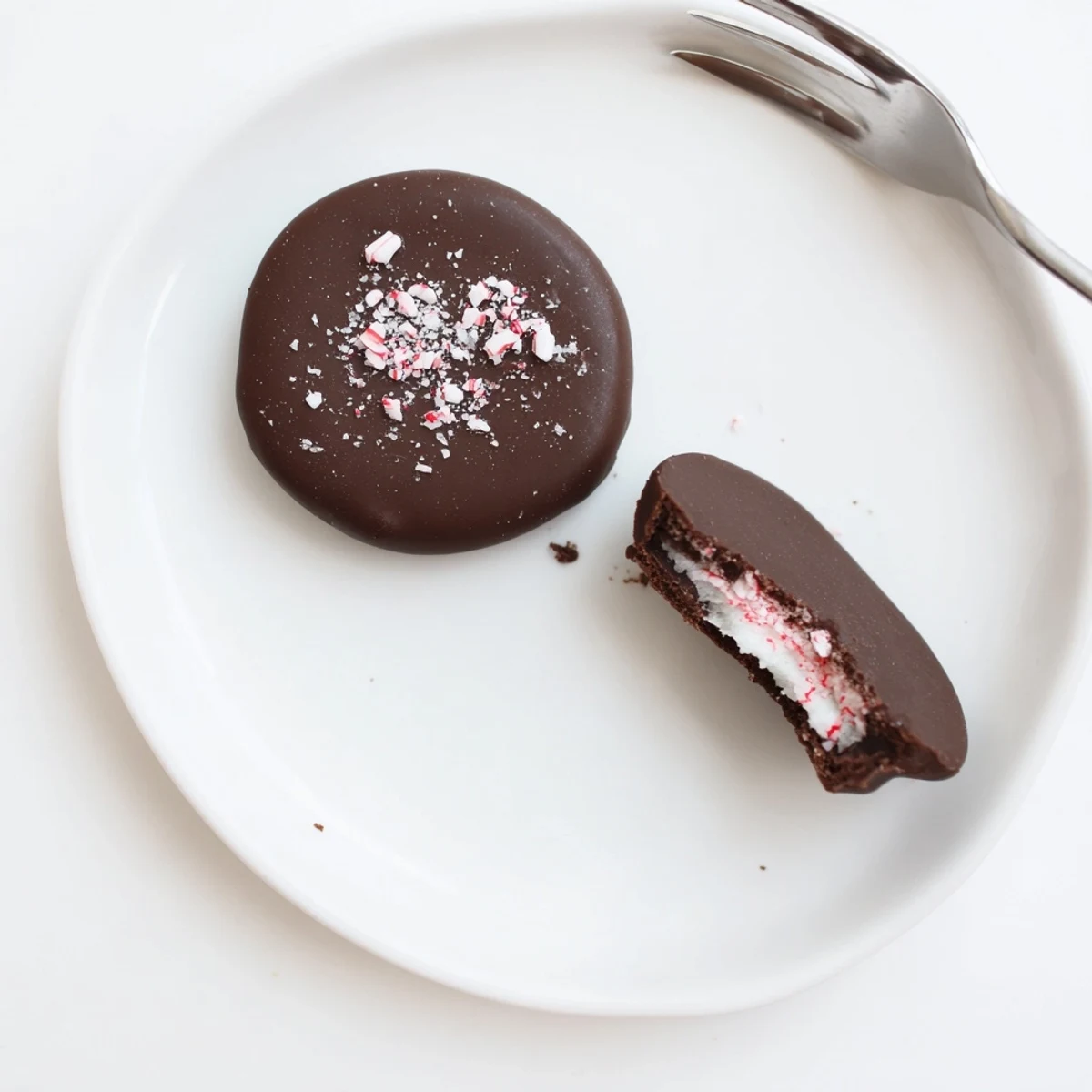 Homemade Peppermint Patties with creamy mint center and rich chocolate sheen.
