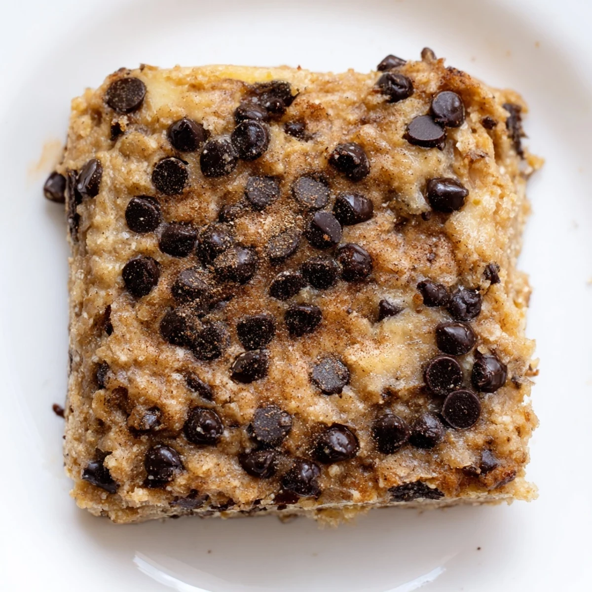 Gluten-free peanut butter banana breakfast bars sliced into squares, topped with flaky sea salt garnish