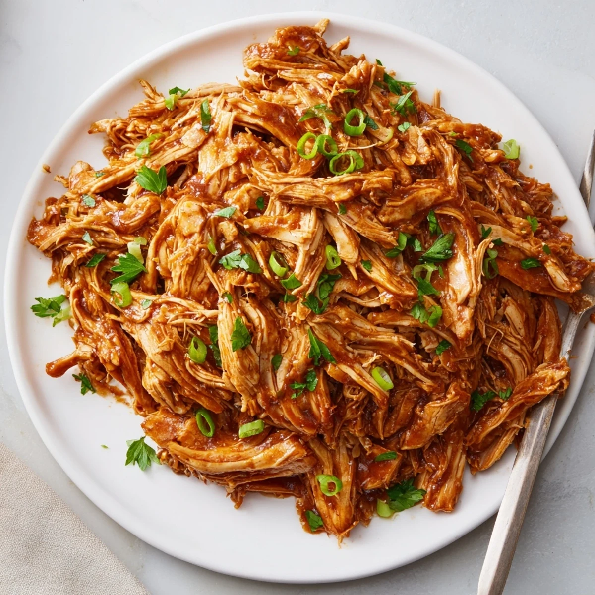 Slow Cooker Brown Sugar Garlic Chicken glazed and steaming, served over fluffy rice.