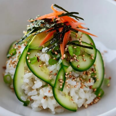 Chilled Sushi Cucumber Salad tossed with tangy rice vinegar dressing, nori
